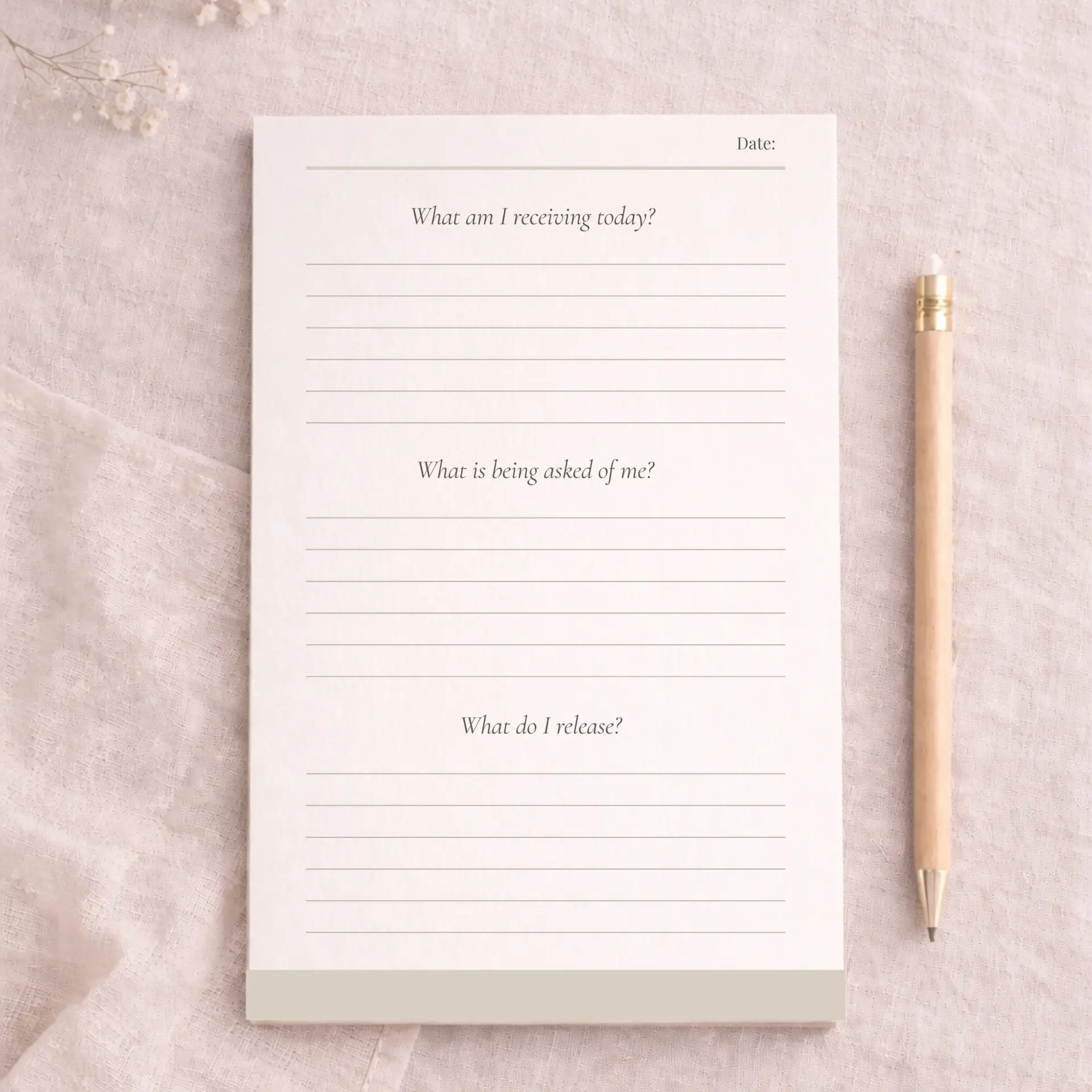 Writing Pad product with 3 question prompts flat lay image with linen background and decorative pencil on the right.