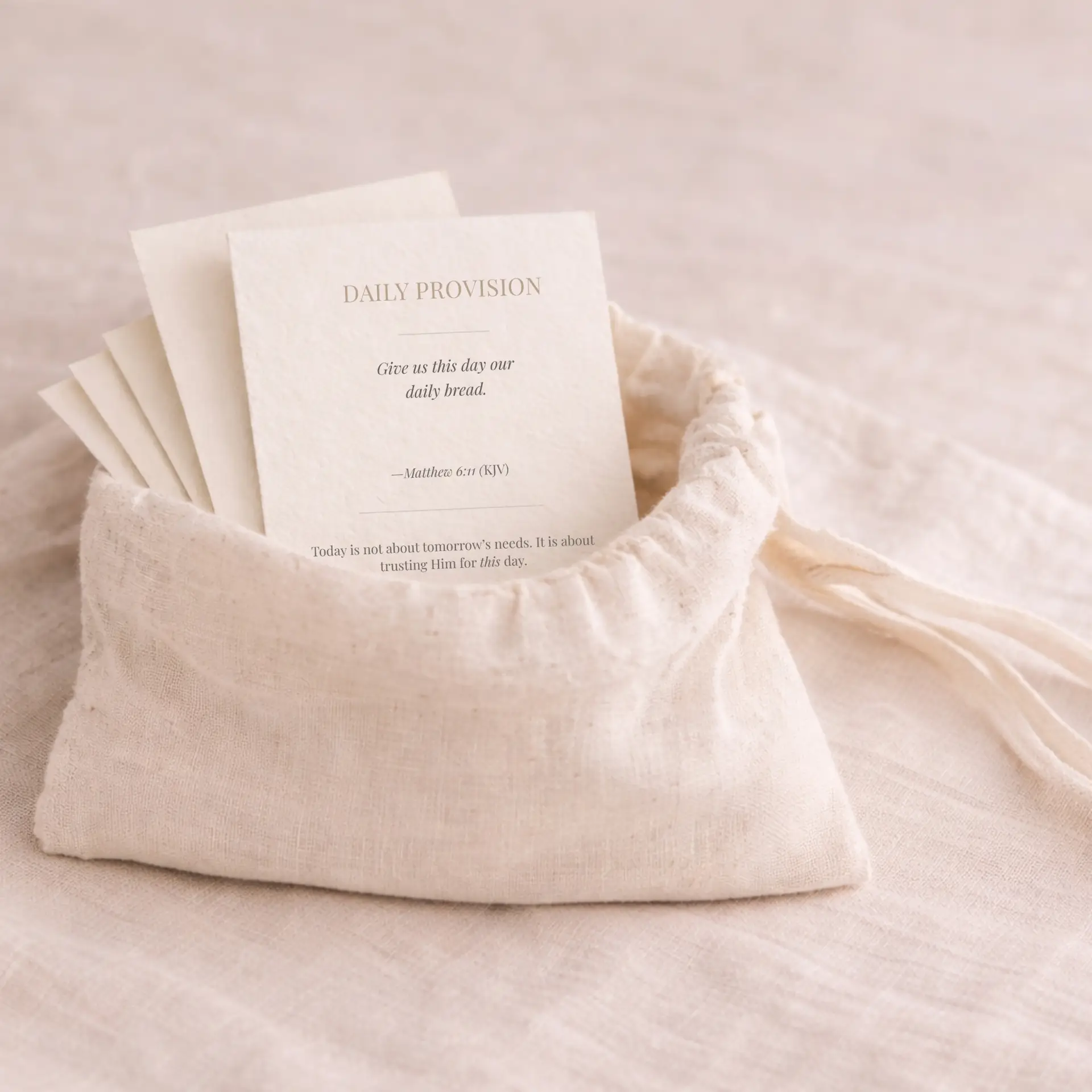 Scripture focus card deck product in a linen drawstring bag on a neutral linen background.